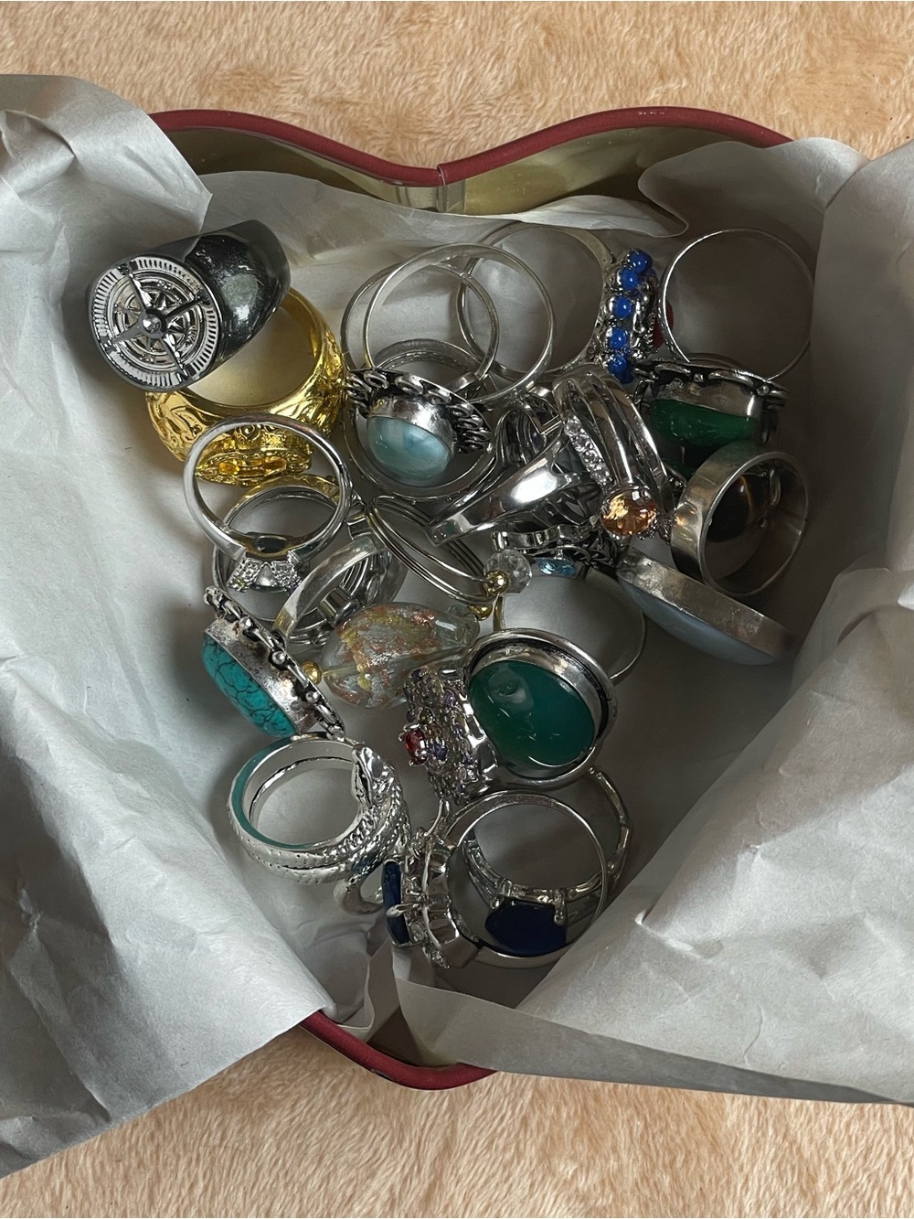 Lot of 22 fashion rings multiple sizes, glass ring holder and heart tin box .